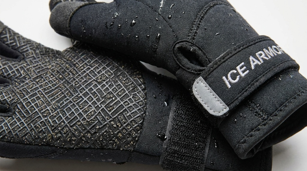 Close up of neoprene ice fishing gloves showing textured rubber palm grip surfaces.